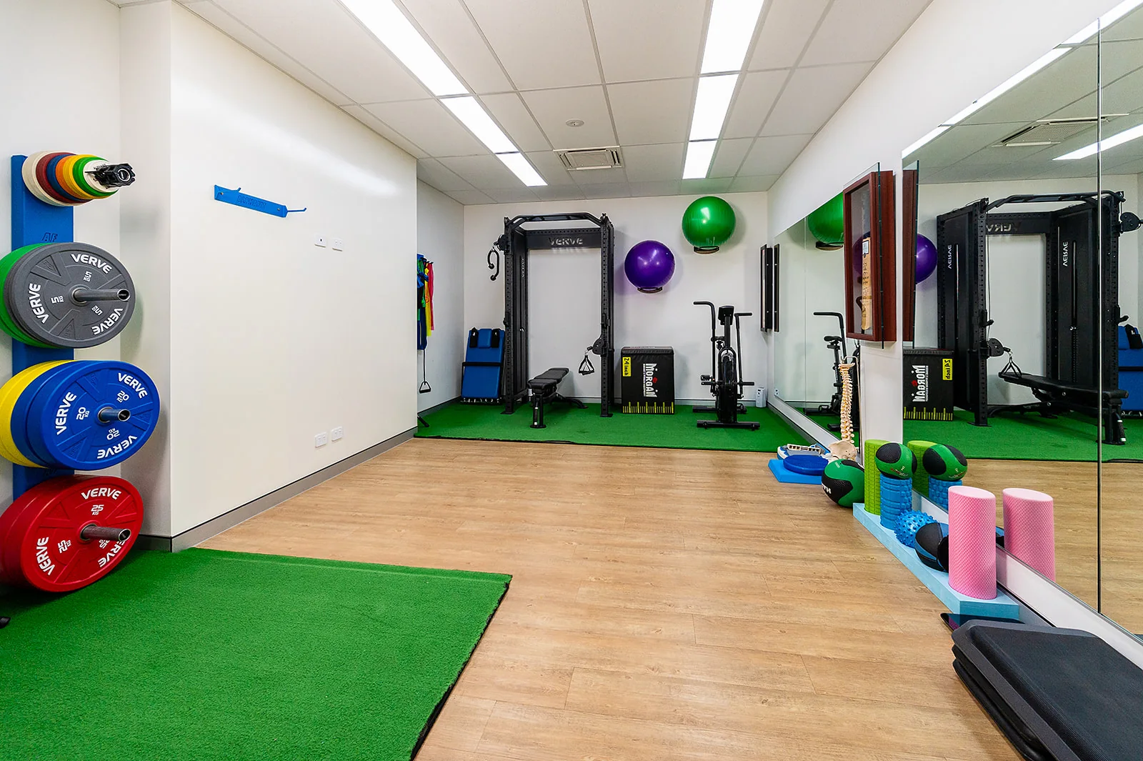 The rehabilitation gym with exercise equipment and open floor space